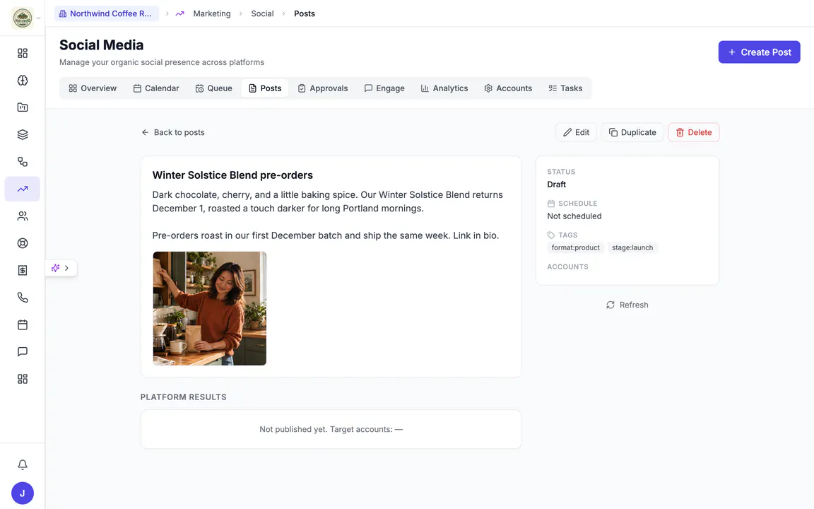 Hiveku social post "Winter Solstice Blend pre-orders": the caption, a picture of a woman shelving coffee bags in her kitchen, status Draft, not scheduled, with tags, and Edit, Duplicate and Delete.
