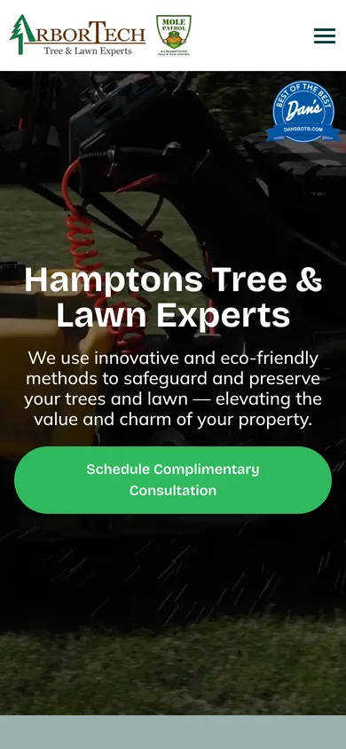 Mobile view of the ArborTech homepage with the logo, a menu button, the Hamptons Tree & Lawn Experts headline and a full-width consultation button.