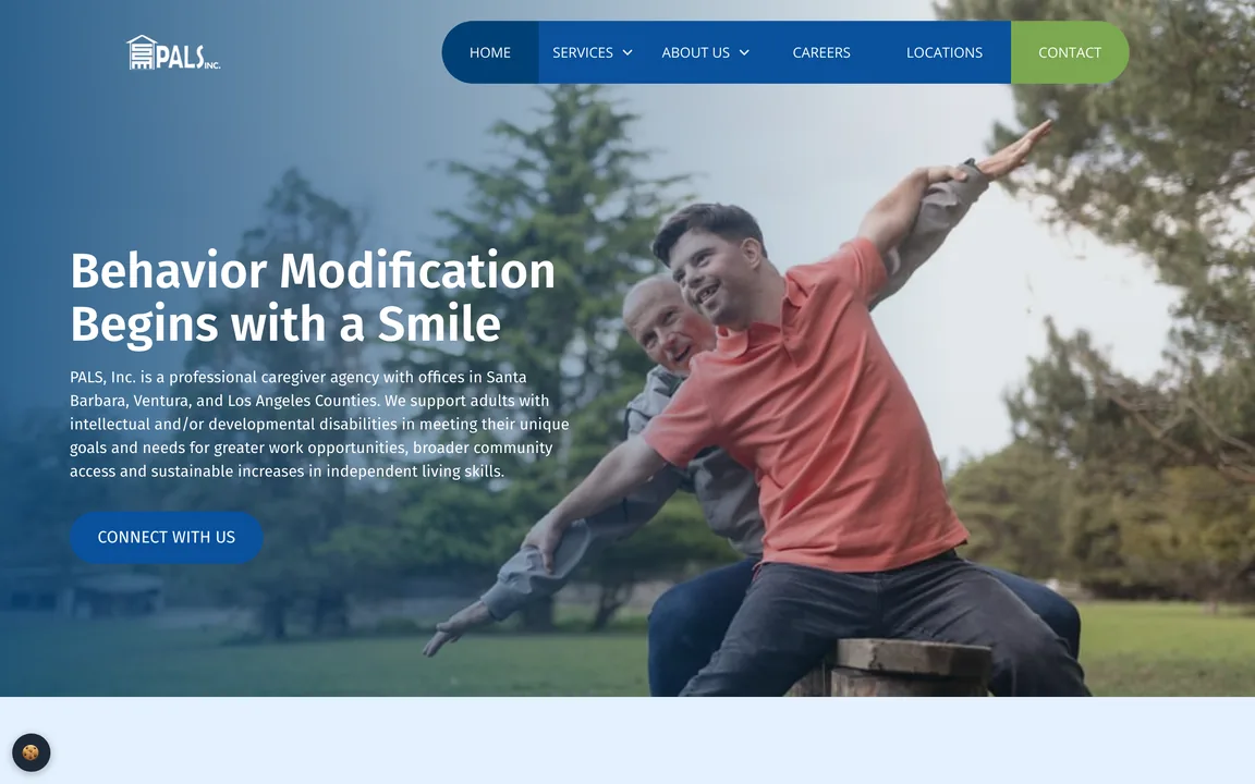 PALS, Inc. homepage with the headline 'Behavior Modification Begins with a Smile' over a photo of two men with outstretched arms in a park, and a 'Connect With Us' button.