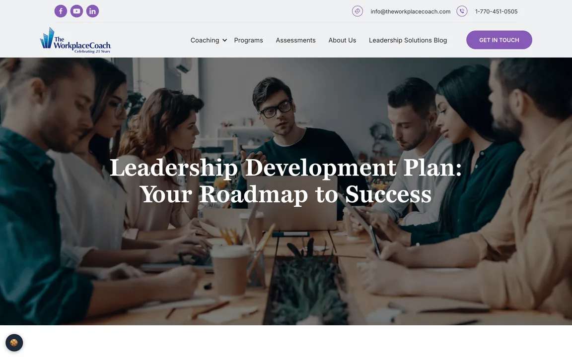 Page headed Leadership Development Plan: Your Roadmap to Success over a photo of a team working at a long table.